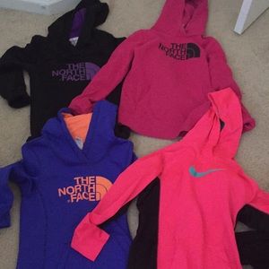 Woman’s northface and Nike hoodies
